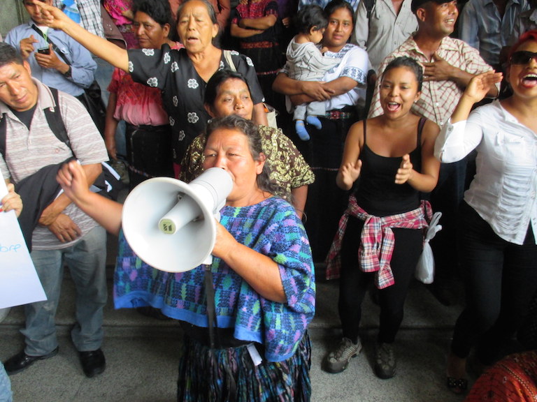 A woman led a crowed in chants demanding President Otto Pérez Molina's resignation. The crowd was gathered right next to the gates of the National Palace in Guatemala City on May 20. Photo by Sandra Cuffe.