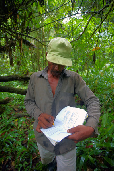 A Miskito community member recording his sightings and signs of mammals and birds during a foot patrol in Nicaragua. Photo by SUNE HOLT.